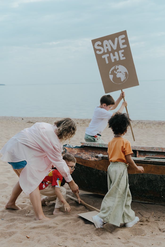 Children and adults work together on a beach cleanup, promoting environmental awareness.